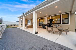 Covered back patio features recessed lighting, gas fireplace, eve outlets and outlets on the north and south pillar.