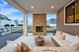 Covered back patio features recessed lighting, gas fireplace, eve outlets and outlets on the north and south pillar.