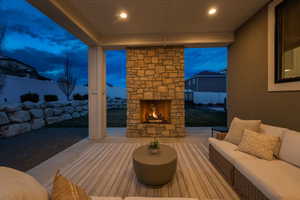 Covered back patio features recessed lighting, gas fireplace, eve outlets and outlets on the north and south pillar.