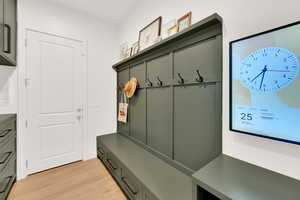Mudroom featuring family calendar management system