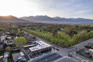 Aerial perspective of suburban area with a mountain backdrop