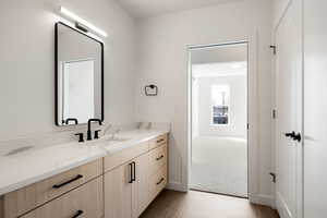 Bathroom with vanity and light wood-type flooring