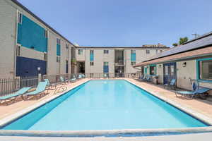 Community pool with a patio area