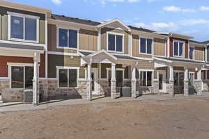 Craftsman inspired home with board and batten siding and stone siding