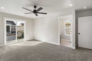 Unfurnished bedroom featuring light colored carpet, ceiling fan, access to outside, and recessed lighting