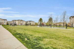Surrounding community featuring a gazebo, a residential view, and a tennis court