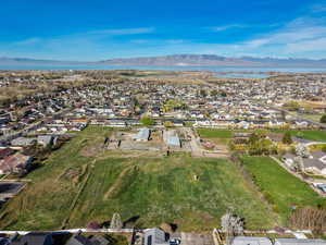 Aerial perspective of suburban area featuring a water and mountain view