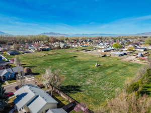 Aerial perspective of suburban area featuring a mountainous background