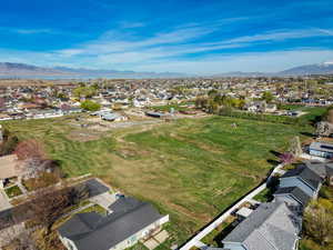 Aerial perspective of suburban area with a mountainous background