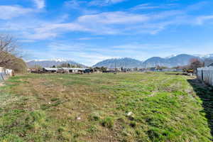 View of mountain backdrop featuring rural landscape