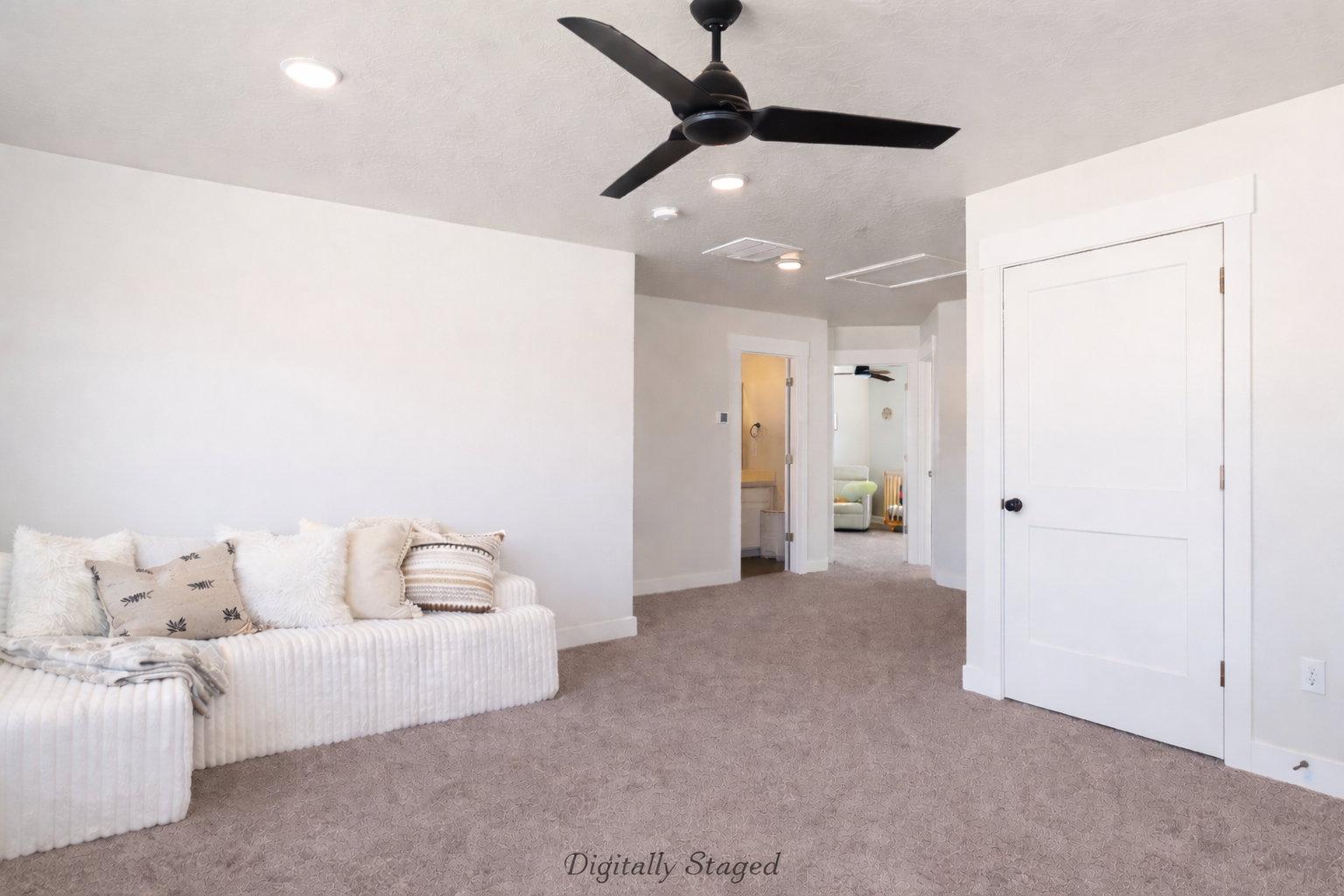 Living area featuring ceiling fan and carpet flooring