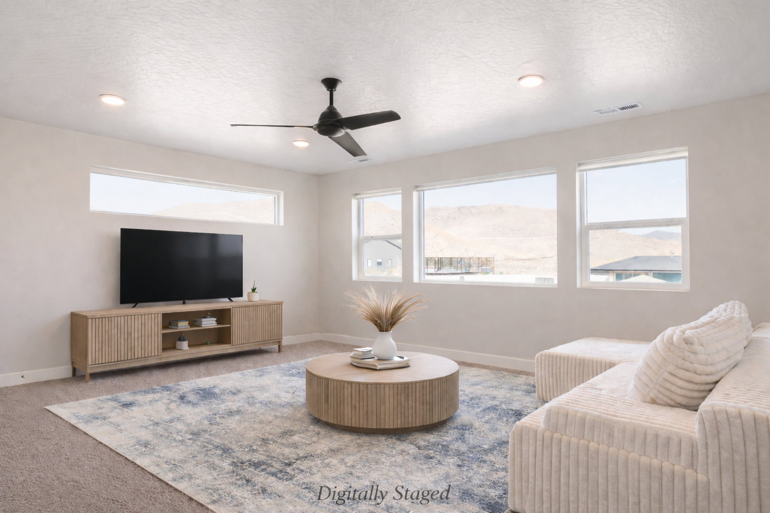 Living area with carpet flooring, ceiling fan, a textured ceiling, and recessed lighting