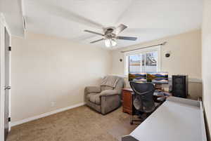 Office space featuring light carpet and ceiling fan