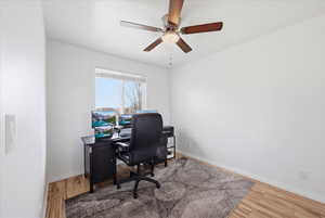 Home office featuring light wood finished floors and a ceiling fan