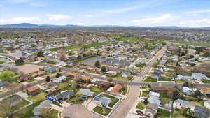 Aerial perspective of suburban area with a mountainous background