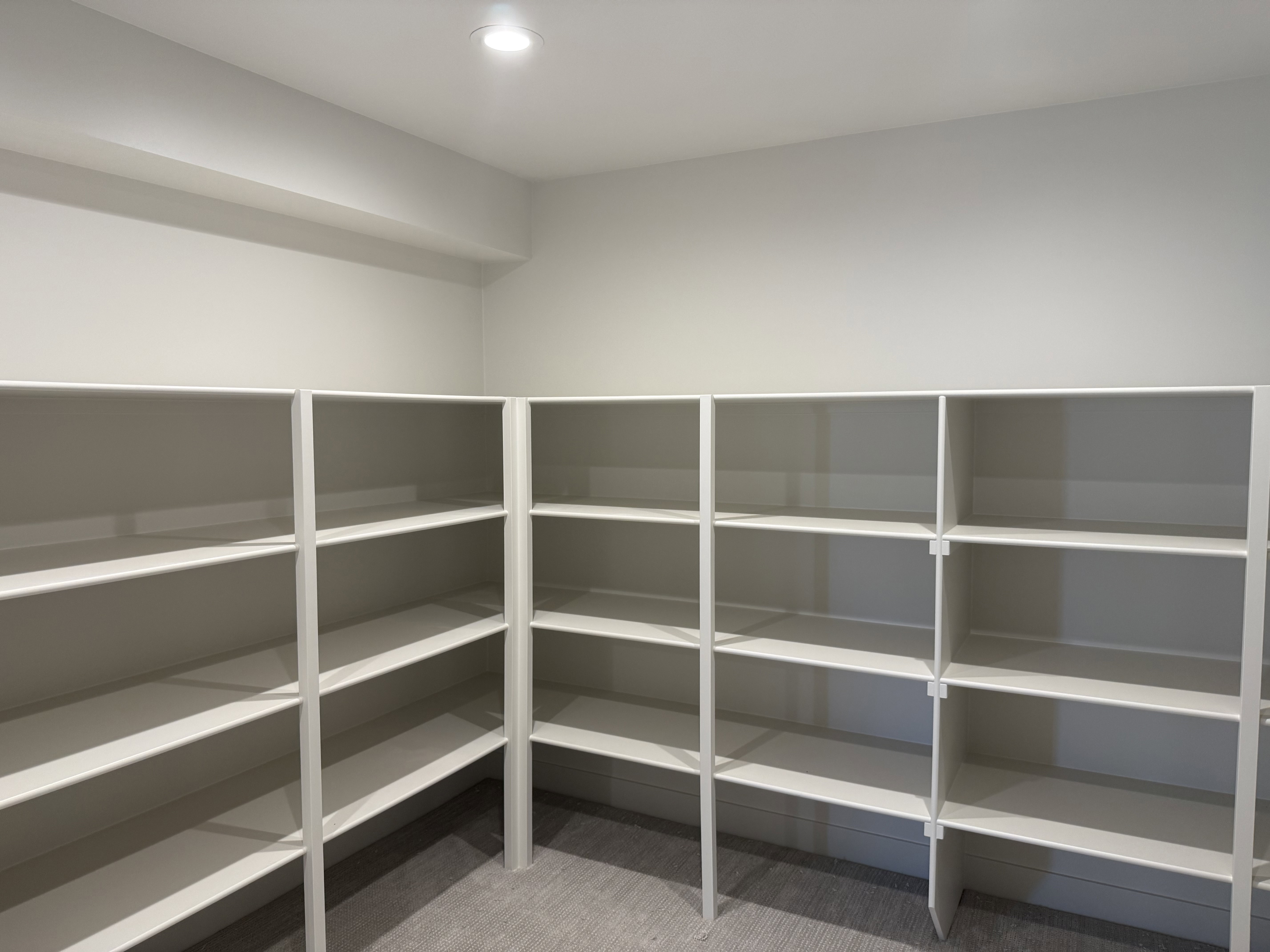 Custom-built shelving system providing extensive storage