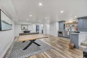 Game room featuring light wood-style floors and recessed lighting