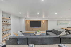 Living room with wood finished floors and recessed lighting