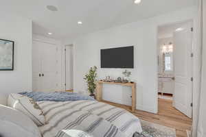 Bedroom with recessed lighting, a closet, and light wood finished floors