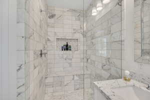 Full bath with vanity and a walk in shower