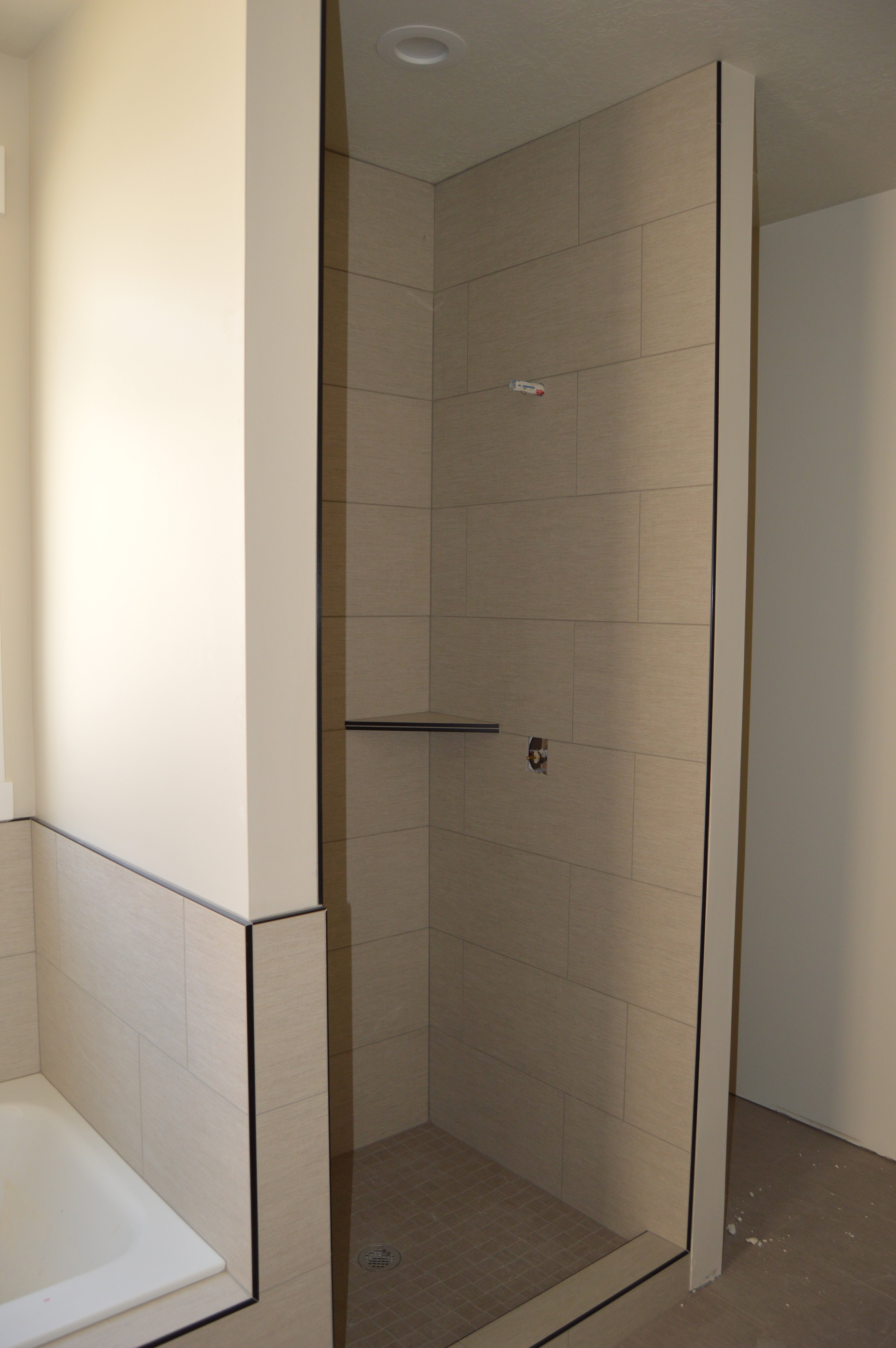 Bathroom with a garden tub and a shower stall