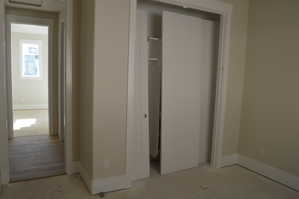 Unfurnished bedroom with baseboards and a closet