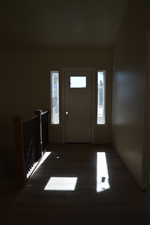 Foyer entrance with dark wood finished floors