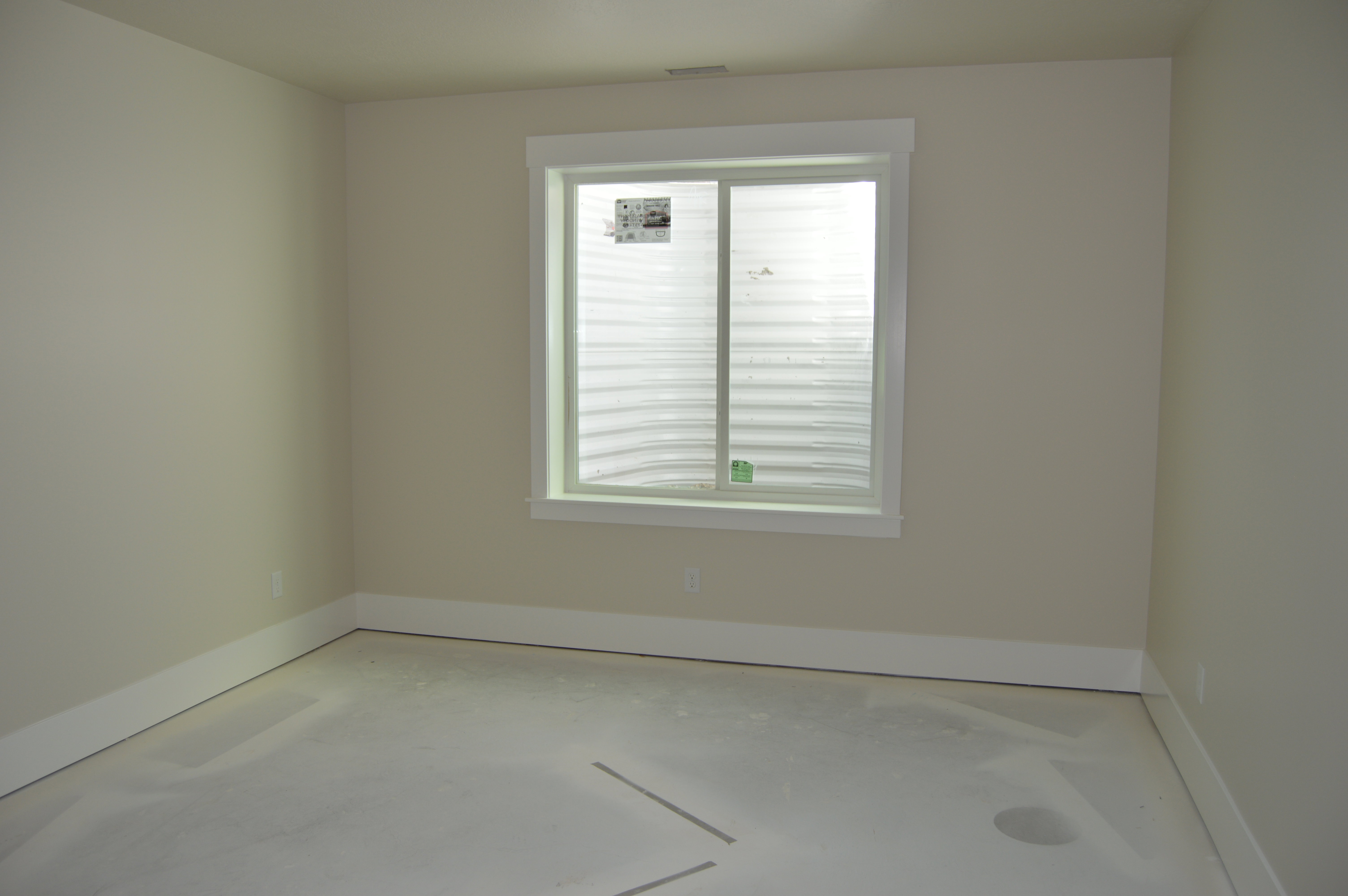 Spare room featuring baseboards