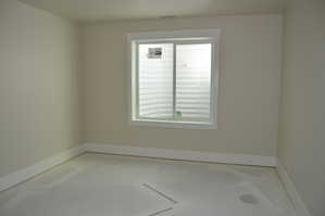 Spare room featuring baseboards