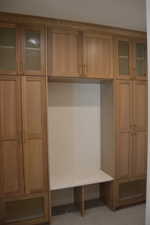 Mudroom with light tile patterned flooring