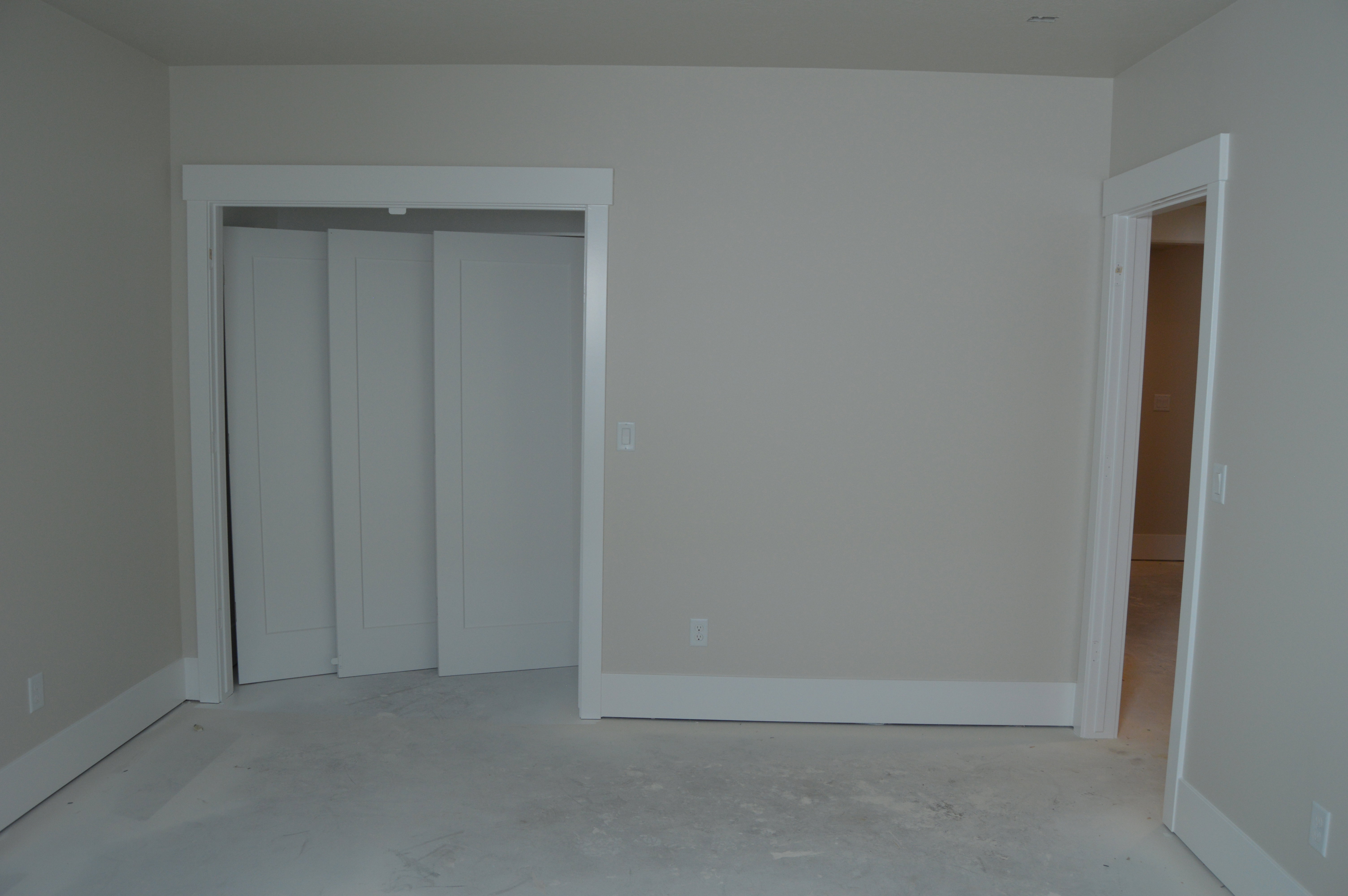 Unfurnished bedroom featuring a closet and unfinished concrete flooring
