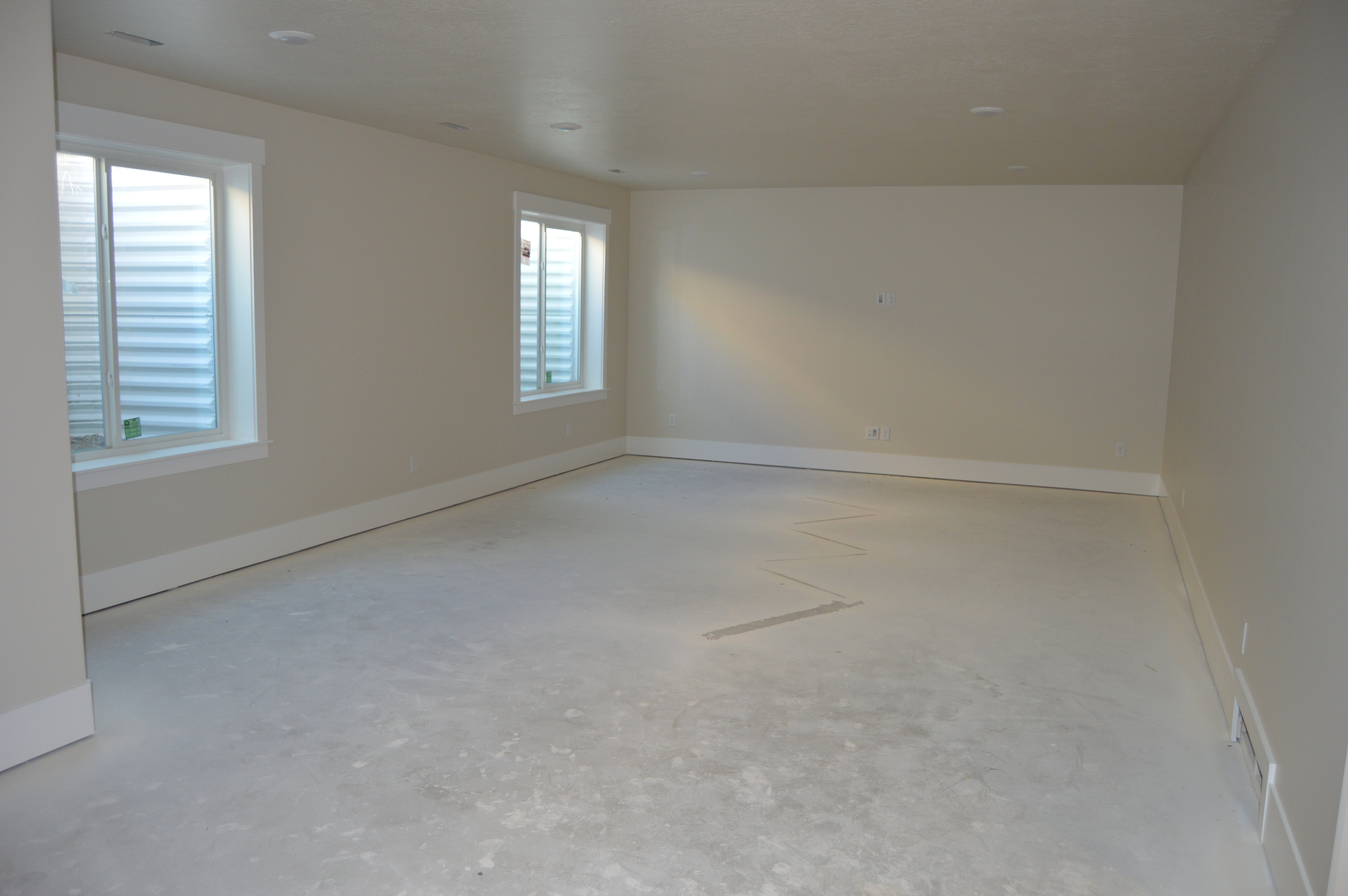 Empty room featuring baseboards