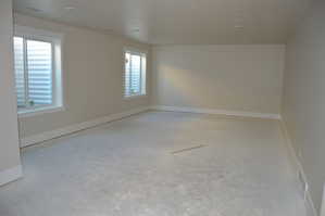 Empty room featuring baseboards