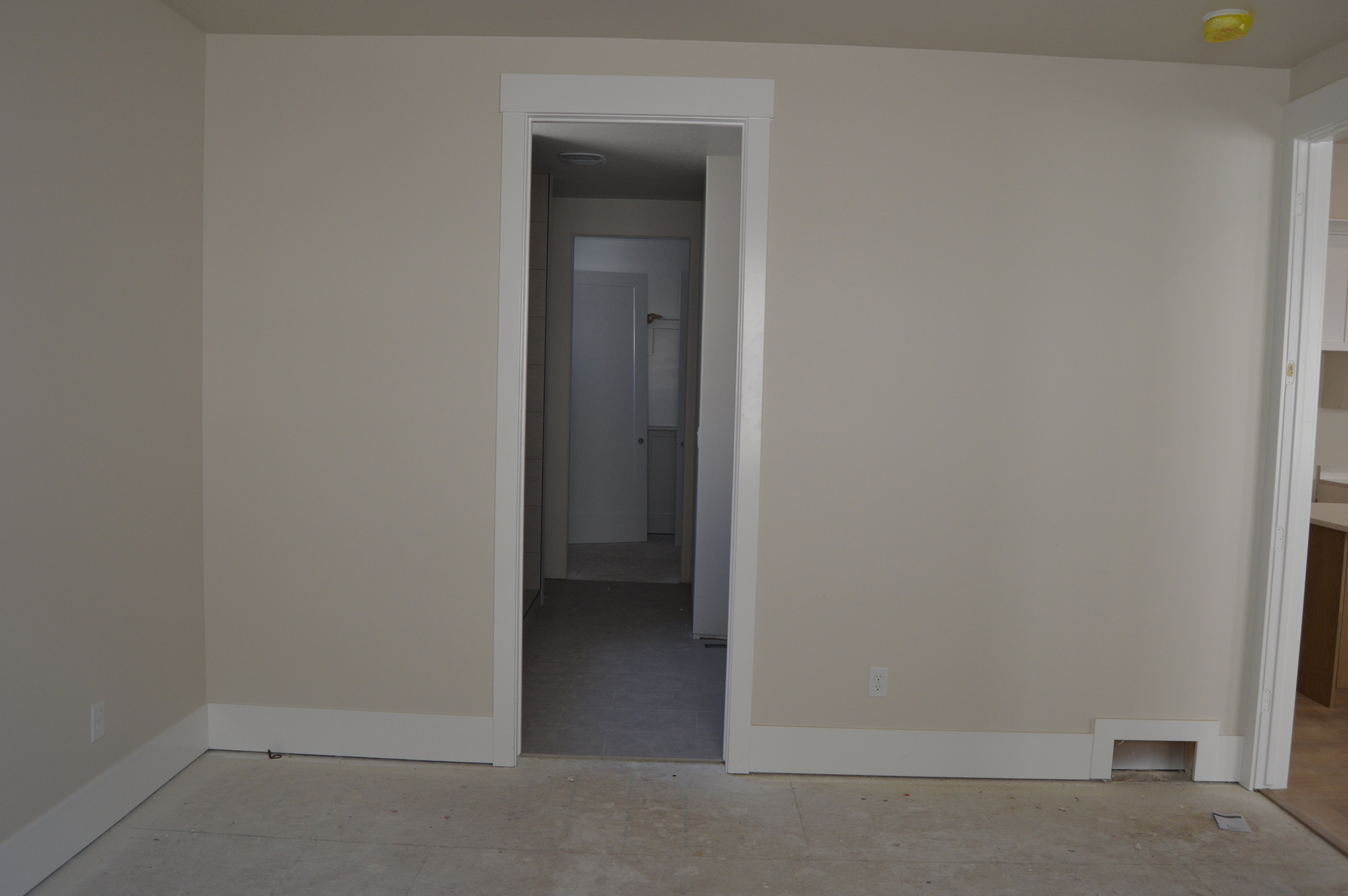 Empty room featuring baseboards