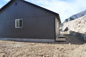 View of property exterior with board and batten siding