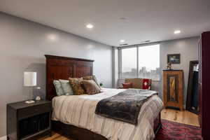 Bedroom featuring wood finished floors and recessed lighting