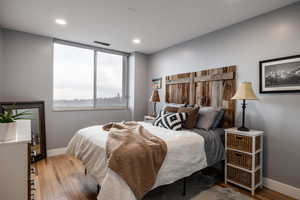 Bedroom featuring light wood-style flooring and recessed lighting