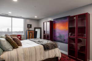 Bedroom featuring recessed lighting and baseboards