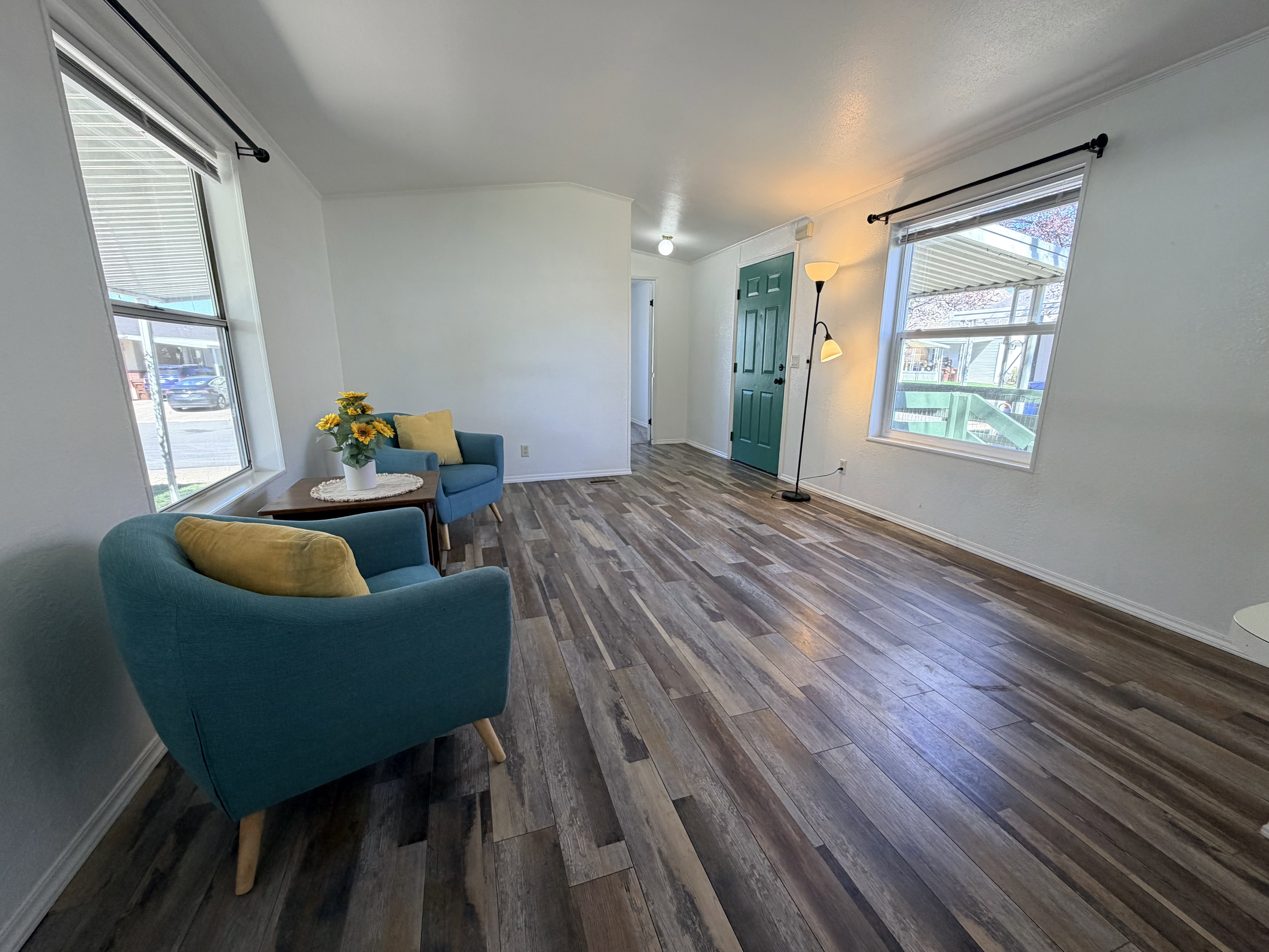Sitting room featuring dark wood-style floors