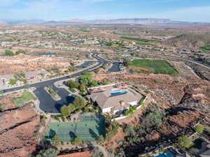 View of property location featuring mountains and nearby suburban area