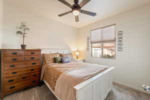 Bedroom featuring carpet and a ceiling fan