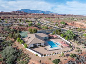 Aerial perspective of suburban area with a mountain backdrop