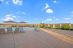 View of patio featuring a community pool