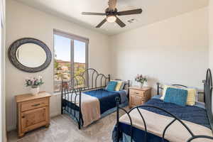 Bedroom featuring carpet flooring and a ceiling fan