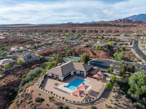 Aerial perspective of suburban area featuring a mountain backdrop