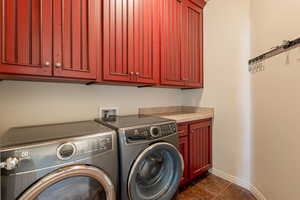 Laundry room with washing machine and dryer and cabinet space