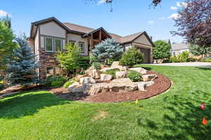 Craftsman inspired home featuring stone, siding and attached 3-car garage