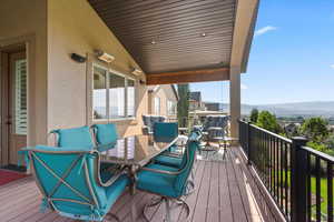Main level, covered deck featuring outdoor dining space with mountain and valley views