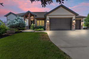 Craftsman inspired home featuring stone, siding and attached 3-car garage