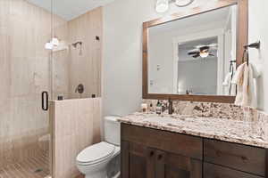 Bedroom 3 en-suite bath with granite countertop and glass enclosed shower